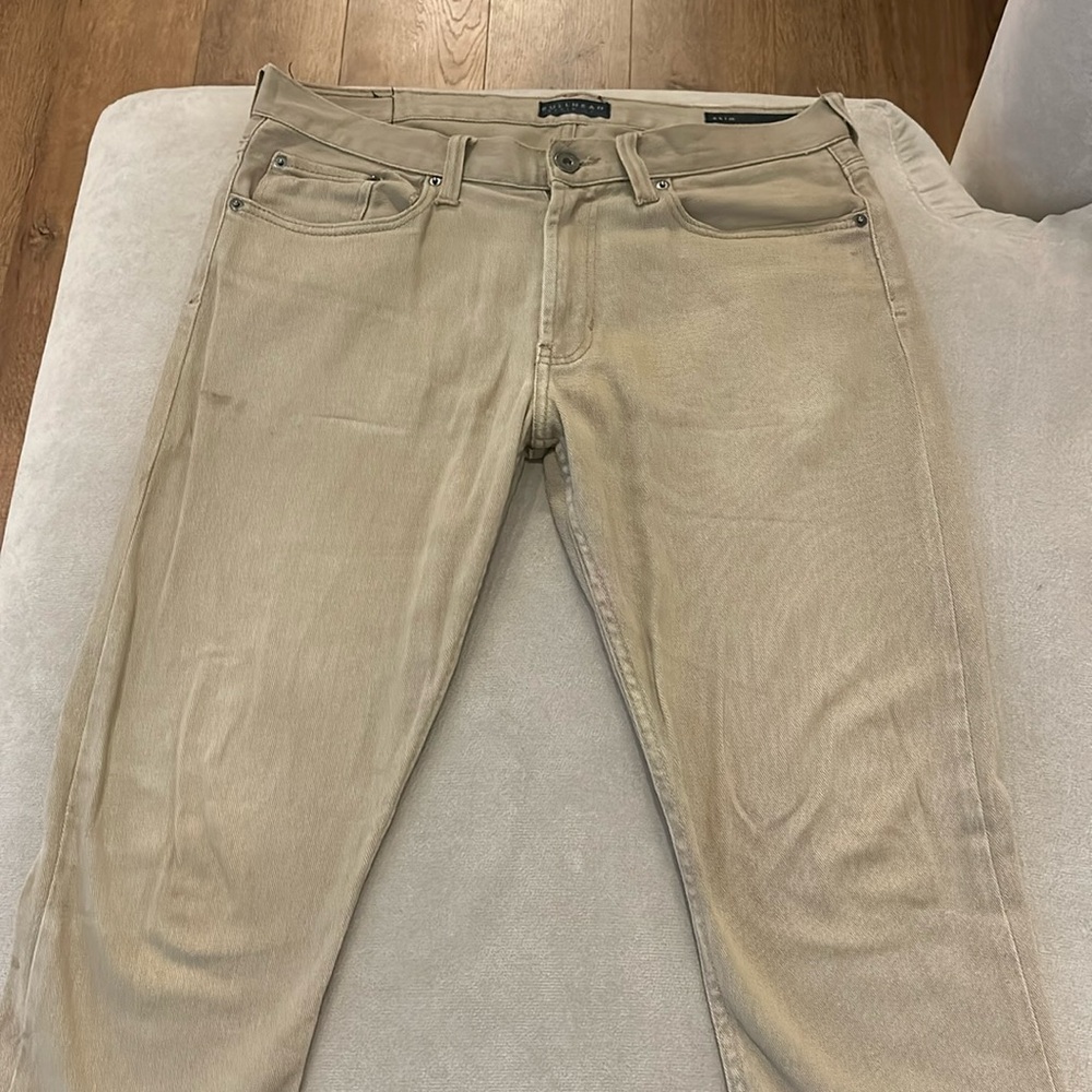 Tan slim pants. Jean-like material